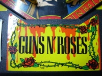 Image # 33423: Guns N' Roses Center Apron Sticker 
(Game has serial number 113655 dated Aug 9, 1994.)