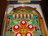 Image # 48723: North Star Sample Game - Upper Playfield 
(The two passive bumpers at the very top of the playfield have blue skirts. Their caps should also be blue. Cabinet has partial serial number ending with '076 S'.)