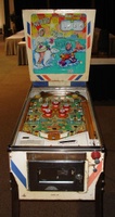 Image # 48730: North Star Sample Game - Front View 
(The two passive bumpers at the very top of the playfield have blue skirts. Their caps should also be blue. The backglass has red fade. Cabinet has partial serial number ending with '076 S'.)