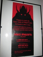 Image # 43652: Space Invaders Promotional Poster 
(The poster inside the frame measures 10 cm by 23 cm.)