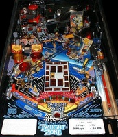 Image # 3186: Twilight Zone Playfield 
(Note that the pop bumper caps do not match those shown in the flyer and do not match those awarded via the skill shots.)