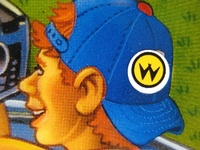 Image # 41948: Whirlwind Translite Detail - Williams Logo Sticker 
(This adhesive sticker was applied directly onto the translite. From a game with serial number 574 I335770.)