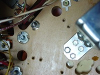 Image # 29711: Junk Yard Prototype Playfield Underside 
(Picture shows holes in a prototype playfield for scoring switches in the upper right hand corner of the playfield.)