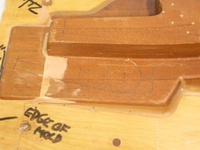 Image # 70324: Medieval Madness Right Ramp Prototype Mold 
(This solid wood tool was used to prototype thermoform the right plastic ramp (part number 03-9680.8). It measures approximately 24 x12 x 9 inches including the wood base.)