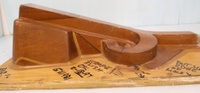 Image # 70326: Medieval Madness Right Ramp Prototype Mold 
(This solid wood tool was used to prototype thermoform the right plastic ramp (part number 03-9680.8). It measures approximately 24 x12 x 9 inches including the wood base.)