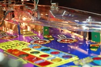 Image # 36248: Wheel Of Fortune Early Production on Assembly Line 
(Images 36235 through 36269 show one of the first ten or so games being assembled at the factory. Some playfield parts may have not yet been installed on this playfield.)