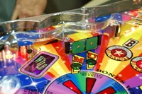 Image # 36252: Wheel Of Fortune Early Production on Assembly Line 
(Images 36235 through 36269 show one of the first ten or so games being assembled at the factory. Some playfield parts may have not yet been installed on this playfield.)