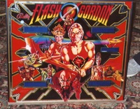 Image # 12140: Flash Gordon Early Production Backglass 
(This is from the game with serial number 1001, the first game produced.  Note the blue tinting where the score displays are located.)