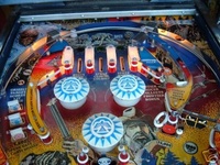 Image # 29645: Frontier Upper Playfield 
(The center stand-up target shown here (below the bottom pop bumper) is not original to this game.)